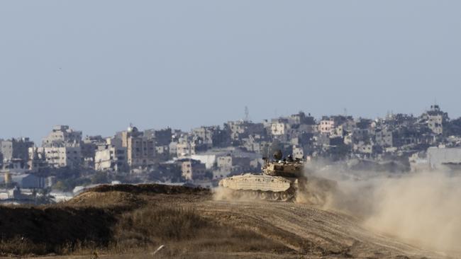 An Israeli tank moves along the border with the Gaza Strip as seen from a position on the Israeli side of the border. Picture: Amir Levy/Getty Images