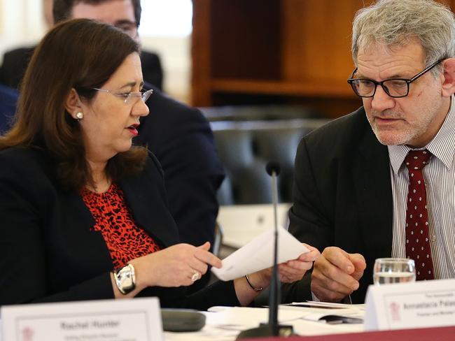 Queensland Premier Annastacia Palaszczuk speaks with Chief of staff David Barbagallo during estimate hearings at Queensland Parliament in Brisbane, Tuesday, July 23, 2019. (AAP Image/Jono Searle) NO ARCHIVING