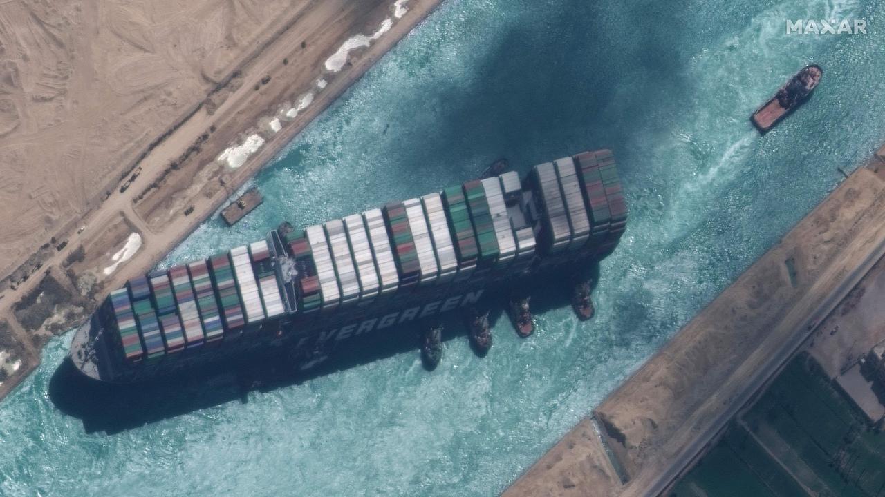 The Ever Given container ship, which got stuck in the Suez Canal on March 29, 2021, caused backlogs that still haven’t been cleared up months later. Picture: Maxar Technologies / AFP