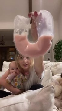 Mum, Jo Johnson, shows the regular colour of her breast milk compared to the pink colour, explaining it's blood which is safe for baby to drink.