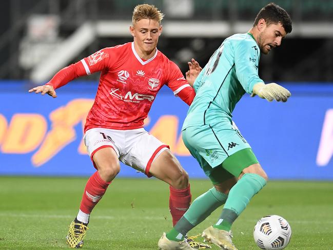 LAUNCESTON, AUSTRALIA - APRIL 22: Ben Waine of the Phoenix makes a tackle on Ryan Scott of Western United during the A-League match between Western United FC and the Wellington Phoenix at University of Tasmania Stadium, on April 22, 2021, in Launceston, Australia. (Photo by Steve Bell/Getty Images)