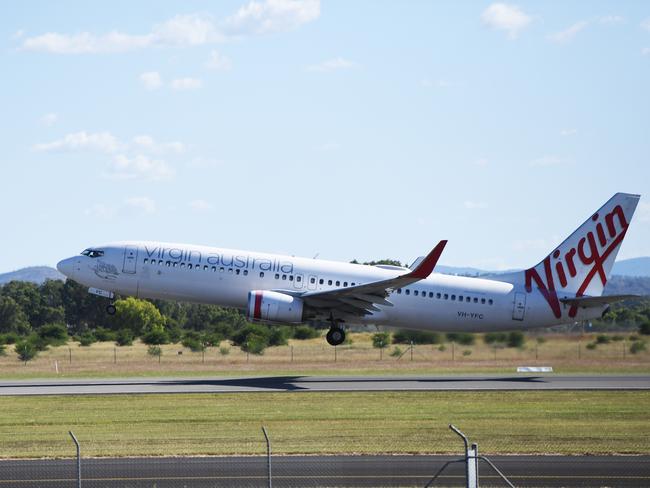 An almost empty Virgin flight departs Rockhampton for Brisbane.