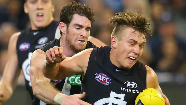 MELBOURNE, AUSTRALIA - MAY 01: Patrick Cripps of the Blues is tackled by Tyson Goldsack of the Magpies during the round five AFL match between the Carlton Blues and the Collingwood Magpies at Melbourne Cricket Ground on May 1, 2015 in Melbourne, Australia. (Photo by Quinn Rooney/Getty Images)