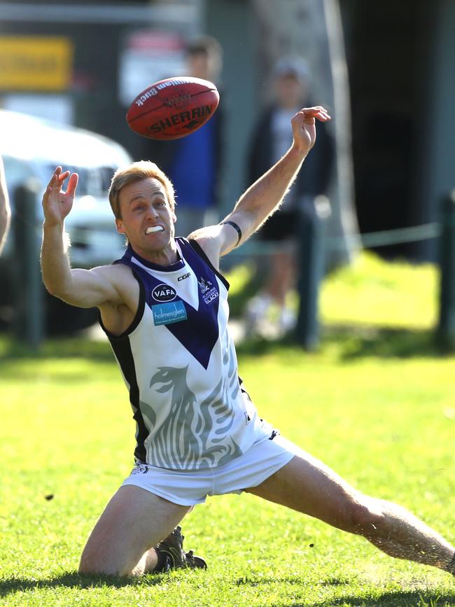 Darren Mumford attempts to control the ball for Uni Blacks.Picture: Stuart Milligan