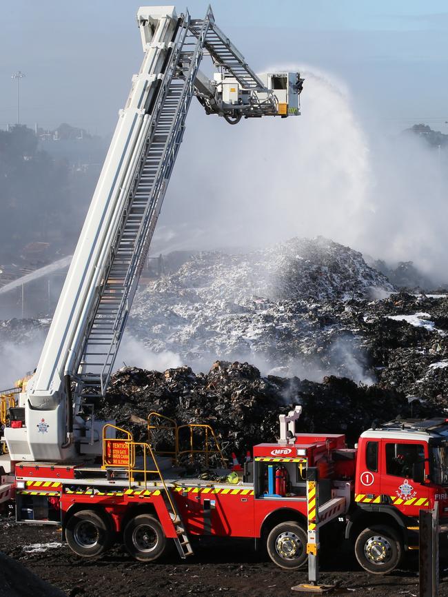 Firefighters at the scene of the Coolaroo recycling plant fire. Picture: David Crosling