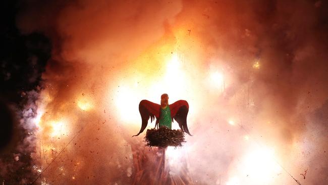 The Swift Parrot surrounded fireworks going off at the Ogoh Ogoh burning at Macquarie Point. Picture: LUKE BOWDEN