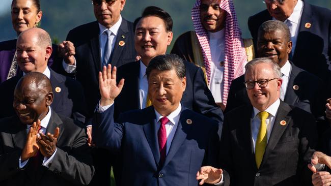 Chinese President Xi Jinping (centre) gestures as he stands alongside Australian Prime Minister Anthony Albanese (right) during a group photo with G20 leaders. Picture: Pool/AFP