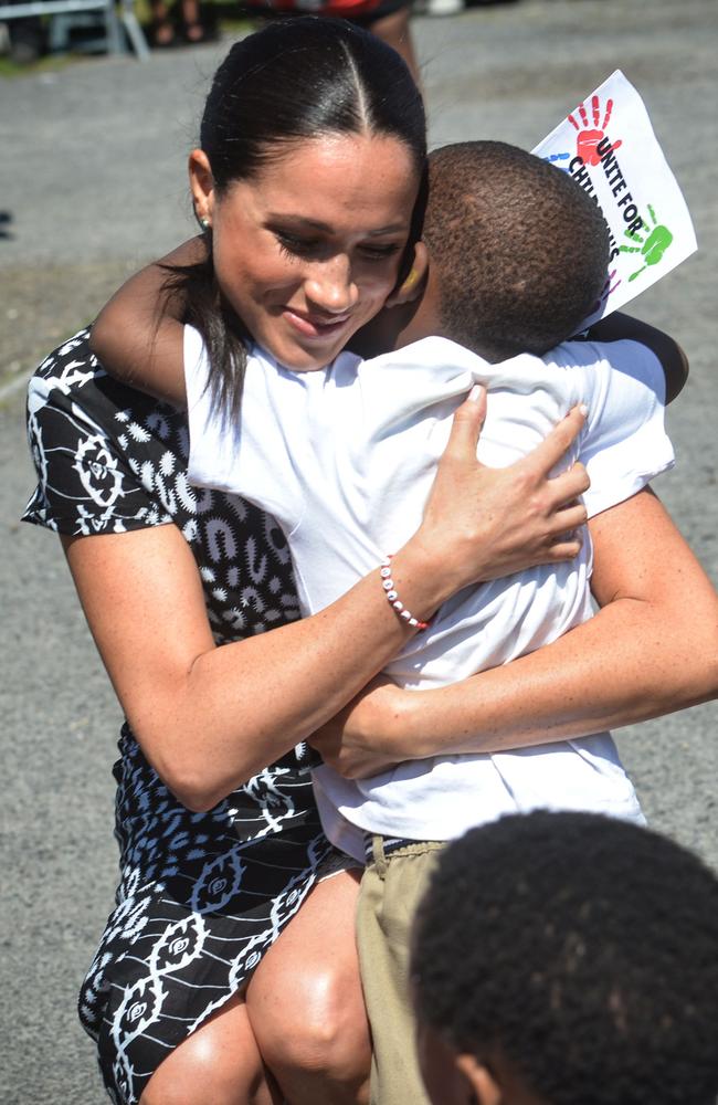 Now that’s a hug. Picture: Courtney Africa/AFP