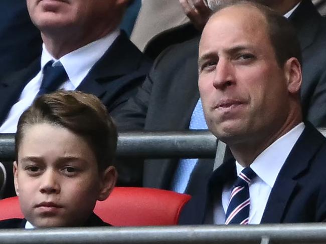 Britain's Prince George of Wales (L) and Britain's Prince William, Prince of Wales attend the English FA Cup final football match between Manchester City and Manchester United at Wembley stadium, in London, on May 25, 2024. (Photo by Ben Stansall / AFP) / NOT FOR MARKETING OR ADVERTISING USE / RESTRICTED TO EDITORIAL USE