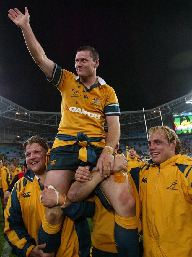 Matt Burke celebrates playing his last game in Australia in 2004.