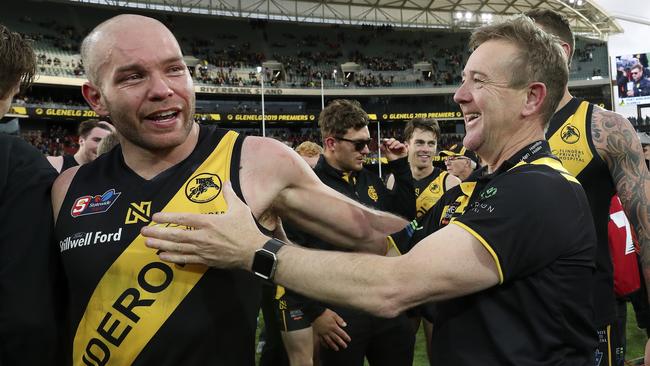 Mark Stone celebrates Glenelg’s grand final win with Aaron Joseph. Picture: Sarah Reed