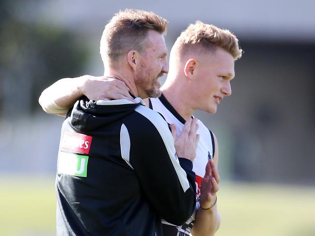 Nathan Buckley gets a hug from Adam Treloar at training . Pic: Michael Klein