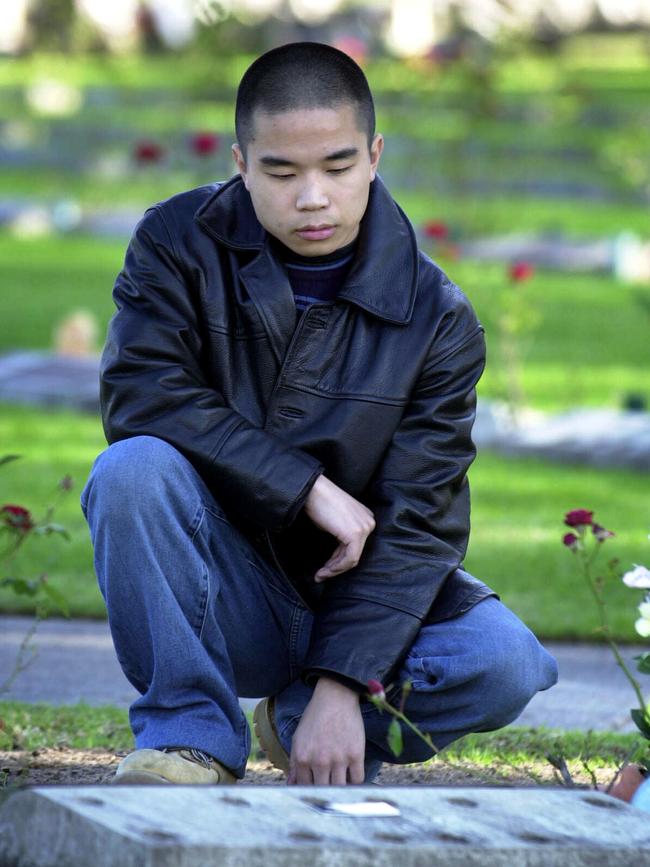 Gonzales visiting the gravesite of his family before his arrest.