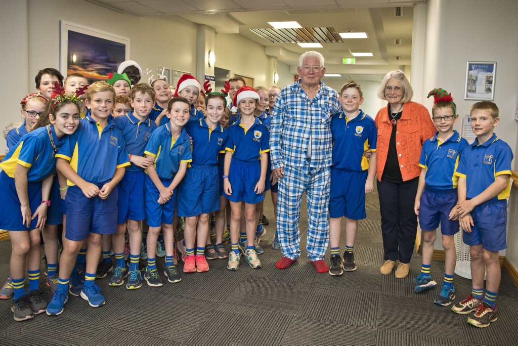 Jasper Pennell (centre) met with his grandad patient Paddy Osborne and grandmother Dawn Osborne, as Mater Dei Primary School Yr 4 students sing Christmas carols in the wards of St Vincent's Private Hospital, Friday, November 29, 2019. Picture: Kevin Farmer