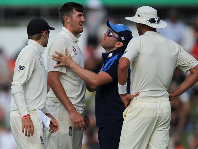 Craig Overton leaves the field after succumbing to a rib injury.