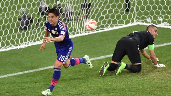 Japan's Shinji Kagawa celebrates after he scored the Blue Samurai’s second goal.