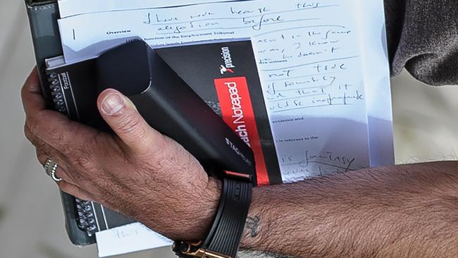 Portuguese football manager Jose Mourinho is pictured carrying written notes as he returns to his home in London on May 24, 2016. Mourinho is on the verge of fulfilling his dream of managing Manchester United after Louis van Gaal's troubled two-year reign at Old Trafford came to a bitter end. Van Gaal said he was "very disappointed" to be sacked on May 23, just 48 hours after leading United to victory in the FA Cup final against Crystal Palace. / AFP PHOTO / LEON NEAL