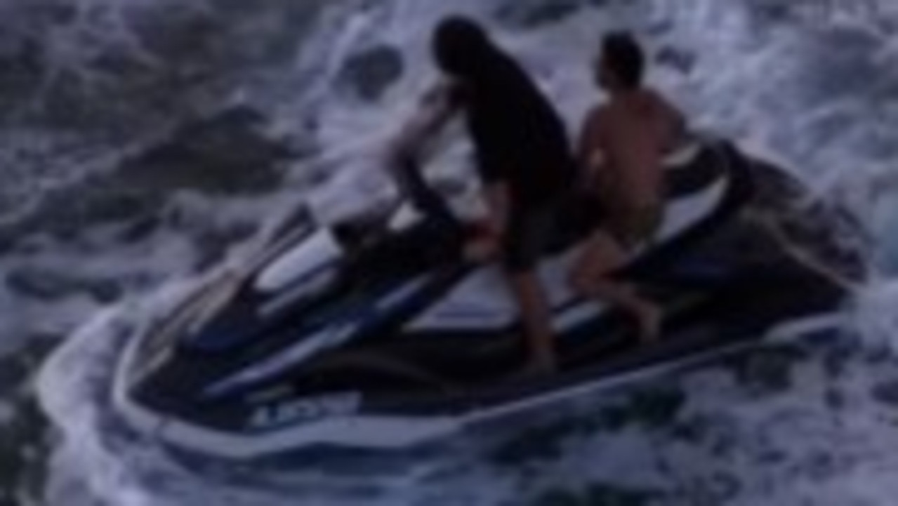 Watch: Dramatic rescue after boat capsizes in shark-infested waters