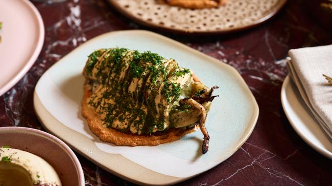 Wood grilled Fraser Coast squid, muhammara, yoghurt, dill, lime at Babylon Brisbane.