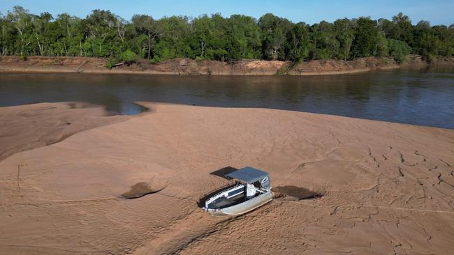 The NT Towing 4x4 Recovery team removed a boat from a sandbank in Daly River, where it sat about 1.5m above water level. Picture: NT Towing 4x4 Recovery/Facebook