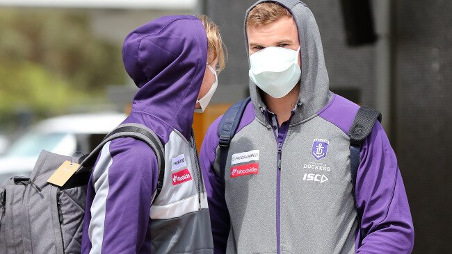 Fremantle players Cam McCarthy and Sean Darcy arrive at Perth Airport for their flight to Melbourne to face Essendon on Saturday.