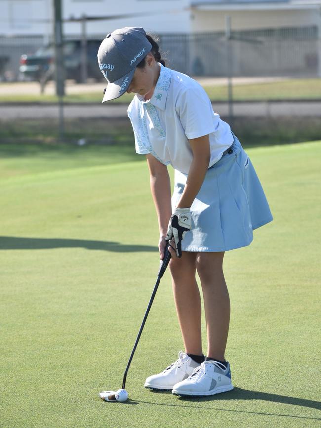 Brisbane's Tiana Belcher (girls eight years and under) gets ready to sink a putt at the US Kids Golf Foundation Australian Open at the Rockhampton Golf Club on September 27.