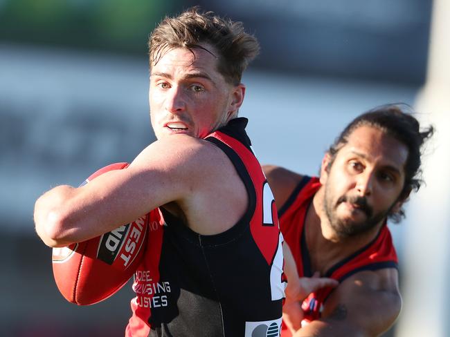 Aaron Anderson clashes with Anthony Wilson in the SANFL. Picture: Sarah Reed