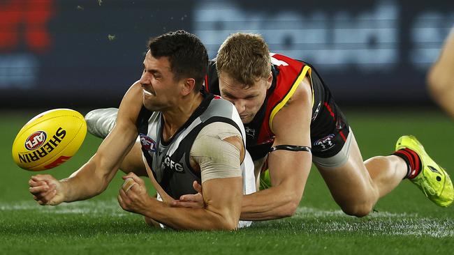 Ryan Burton gets the ball away under pressure from Jake Stringer. Picture: Daniel Pockett/Getty Images