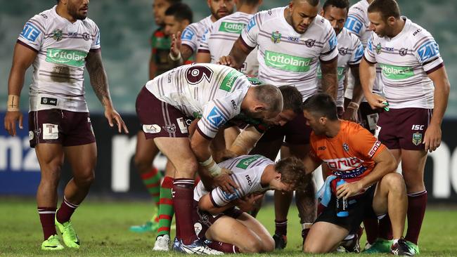 Manly teammates show their concern for Cherry-Evans. (Photo by Mark Kolbe/Getty Images)