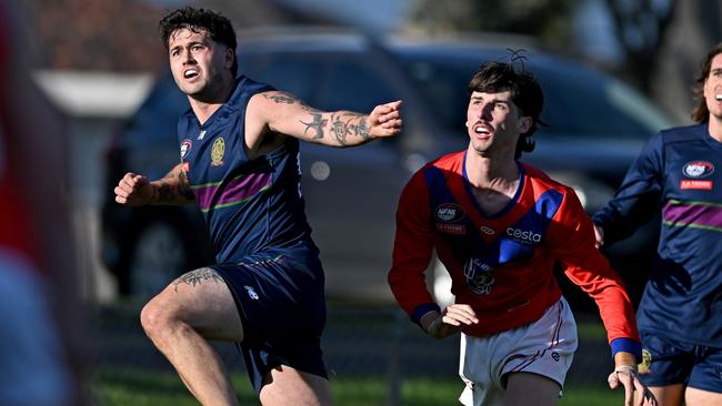 Joel Tolli gets a kick for Old Paradians. Picture: Andy Brownbill