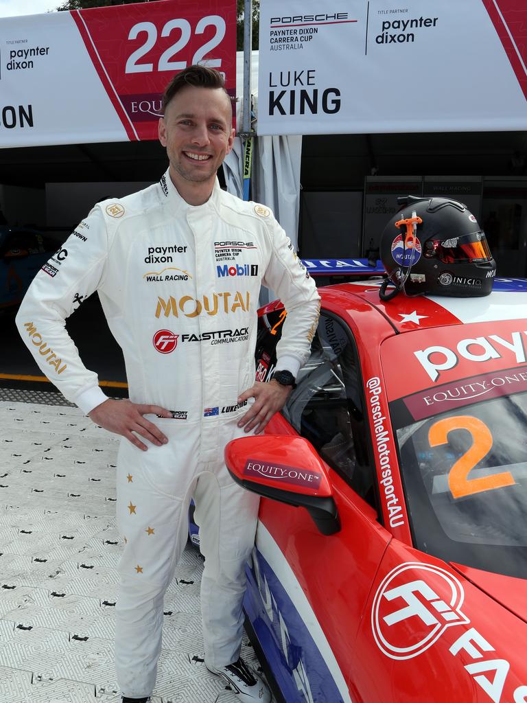 Race driver Luke King with his car at the Melbourne Grand Prix. Picture: Supplied.