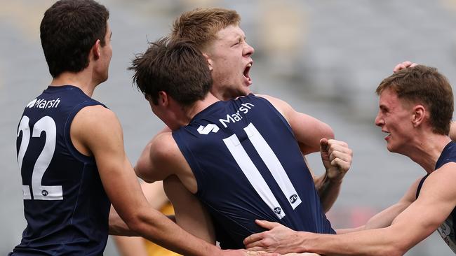 Tom Sims celebrates a goal for Vic Metro.