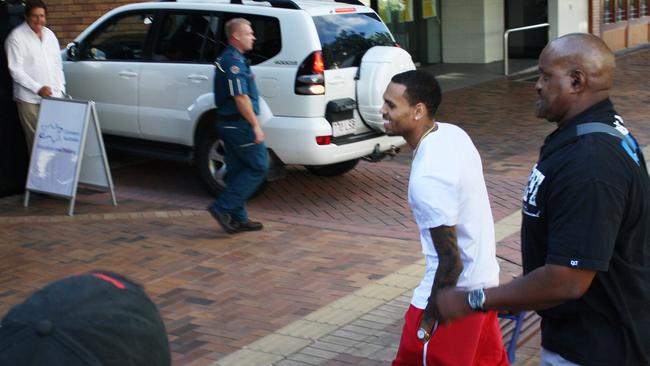 Singer Chris Brown arrives at the Culture Kings store in Southport in 2012 with a security guard. Picture: Stephanie Bedo.