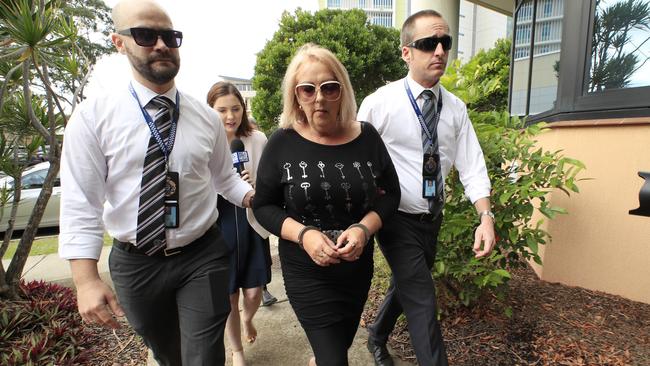 Sharon Graham is brought into custody at the Maroochydore Watchhouse under arrest for the murder of her former partner Bruce Saunders. Picture: Lachie Millard