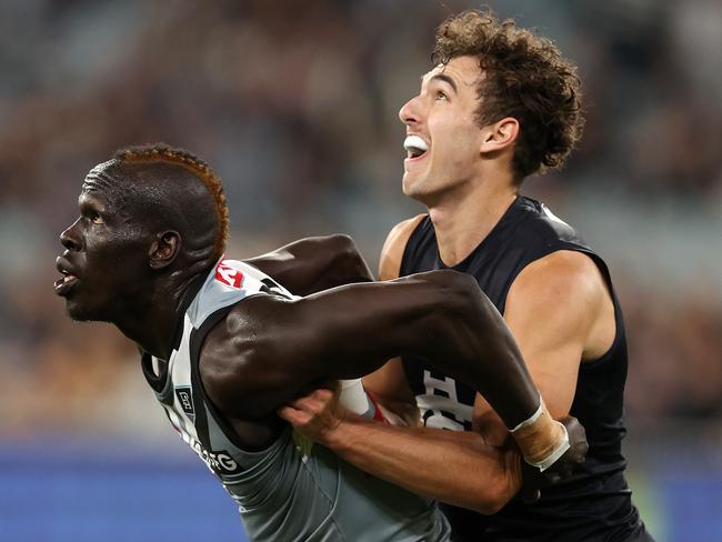 AFL Round 5. 17/04/2021. Carlton vs Port Adelaide at the MCG, Melbourne. Aliir Aliir of the Power and Tom Williamson of the Blues. Pic: Michael Klein