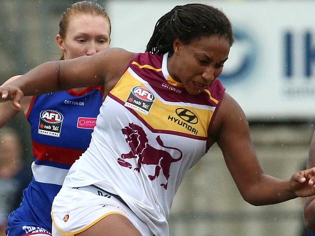 Sabrina Frederick-Traub of the Lions kicks forward during the AFLW grand final match between the Western Bulldogs and the Brisbane Lions at Ikon Park in Melbourne, Saturday, March 24, 2018. (AAP Image/Hamish Blair) NO ARCHIVING, EDITORIAL USE ONLY