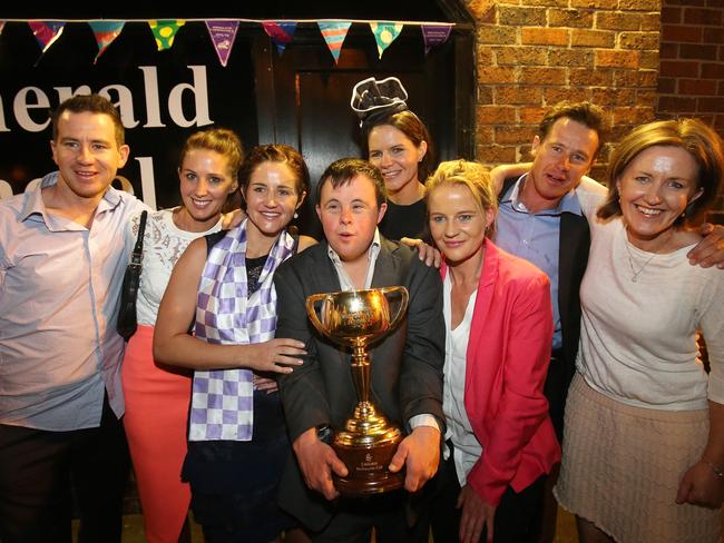 Michelle Payne celebrated with her brothers and sisters: Andrew, Cathy, Michelle, Stephen, Margaret, Bernadette, Patrick and Therese. Picture: Yuri Kouzmin