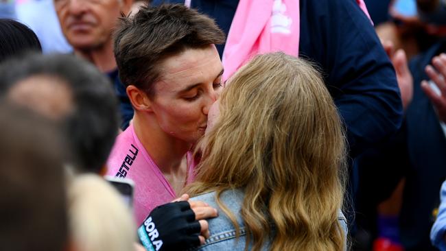 And a kiss with his girlfriend. The pandemic meant he spent years away from his loved ones while training in Europe. Picture: Getty