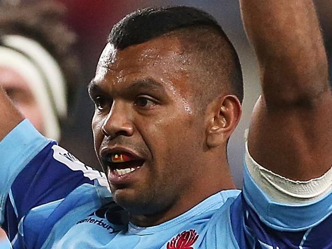 SYDNEY, AUSTRALIA - MAY 03: Kurtley Beale of the Waratahs celebrates a try by team mate Dave Dennis during the round 12 Super Rugby match between the Waratahs and the Hurricanes at Allianz Stadium on May 3, 2014 in Sydney, Australia. (Photo by Mark Metcalfe/Getty Images)