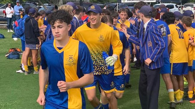 Toowoomba Grammar First XI running out for their game.