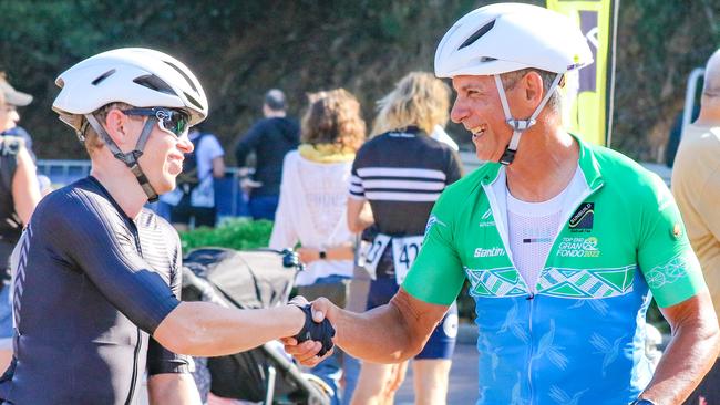 Winner Pete Arnott and fellow finisher John Da Costa in the Annual Gran Fondo finishing at Darwin Waterfront. Picture: Glenn Campbell