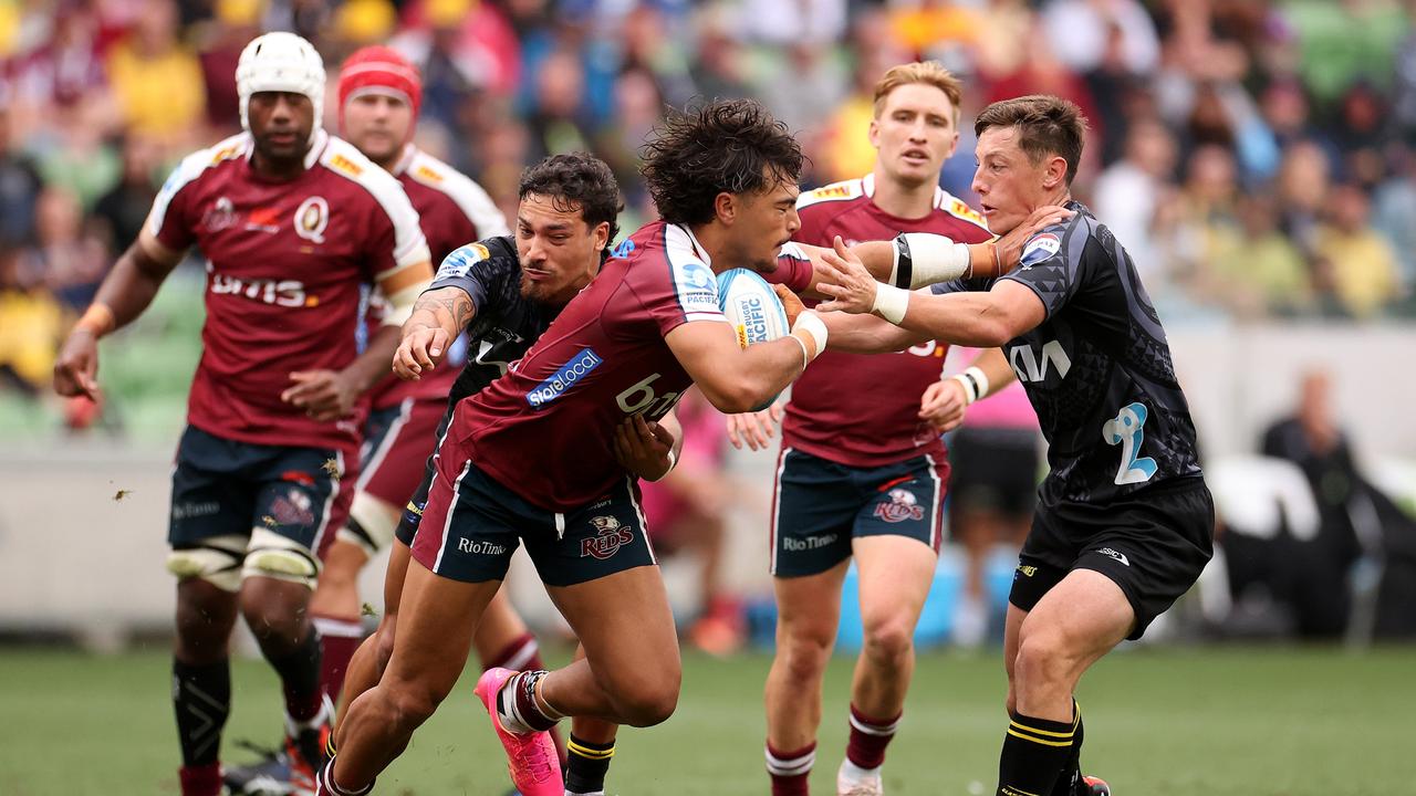 Jordan Petaia (centre) will be missing from Queensland’s team this weekend. Picture: Kelly Defina/Getty Images