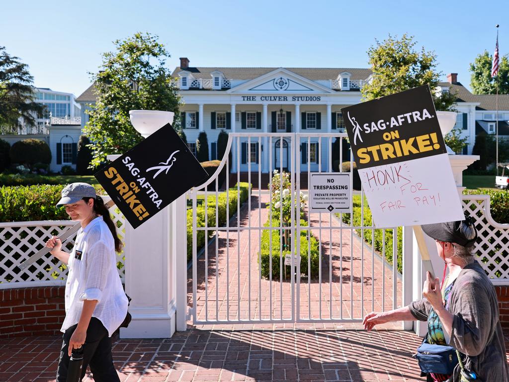 SAG-AFTRA and WGA members walk the picket line outside Culver Studios, home of Amazon Studios, in Los Angeles, California. Picture: Getty Images