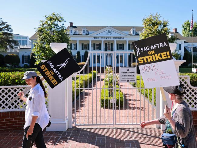 SAG-AFTRA and WGA members walk the picket line outside Culver Studios, home of Amazon Studios, in Los Angeles, California. Picture: Getty Images