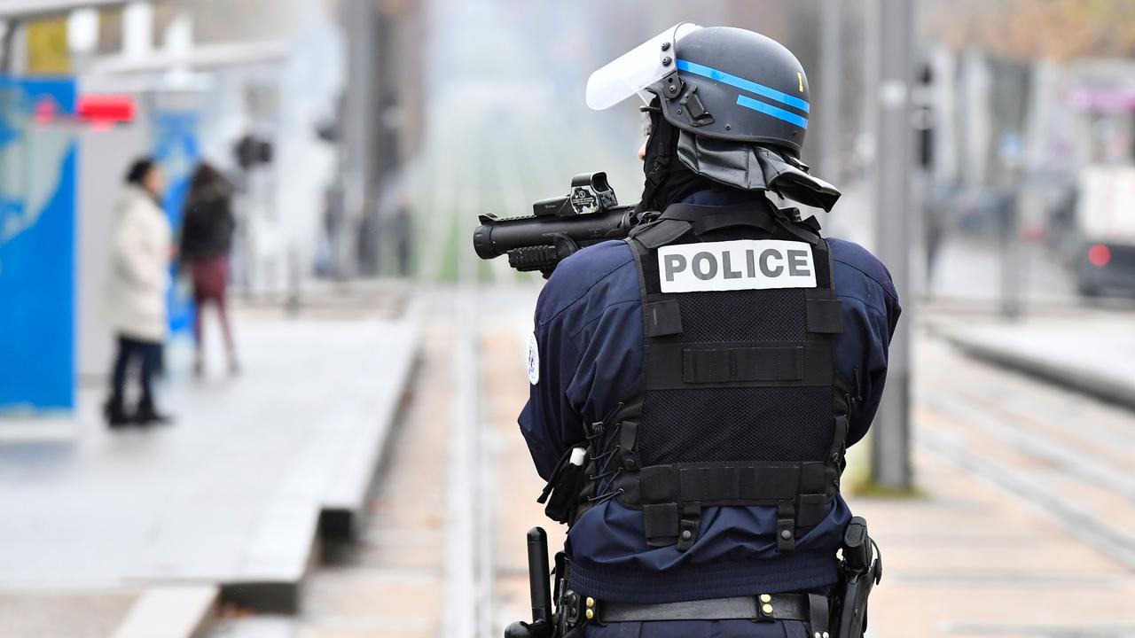 A riot police officer holds a flash ball gun during a demonstration against French government Education reforms on December 3, 2018 in Bordeaux, southwestern France. Picture: AFP