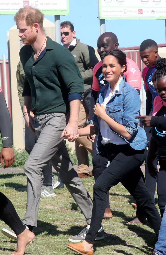 Meghan and Harry held hands as they arrived at Monwabisi Beach. Picture: Chris Jackson/Getty Images