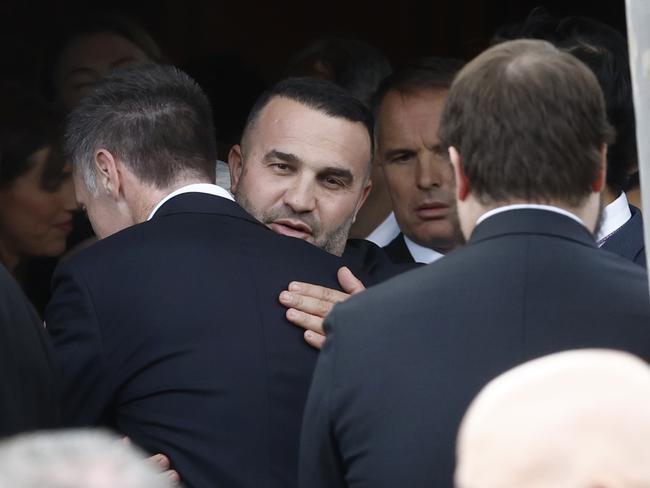 Danny Abdallah, who lost three of his children in the Oatlands crash, embraces Chris Minns. Picture: Richard Dobson