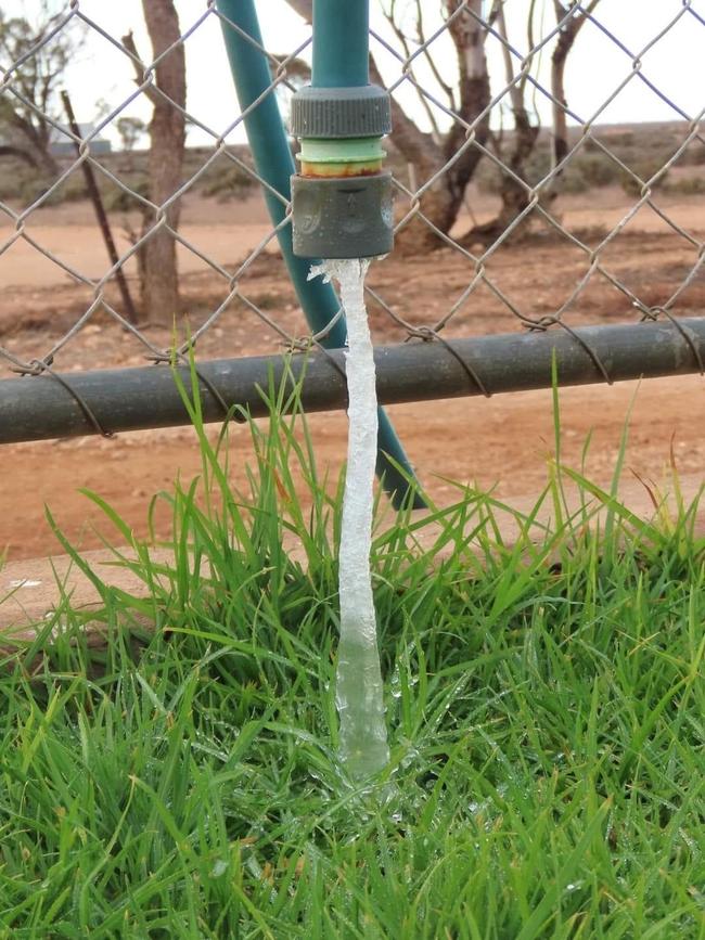 A woman found water from her hose frozen just east of Burra in the state's Mid-north. Picture: Jane Hill