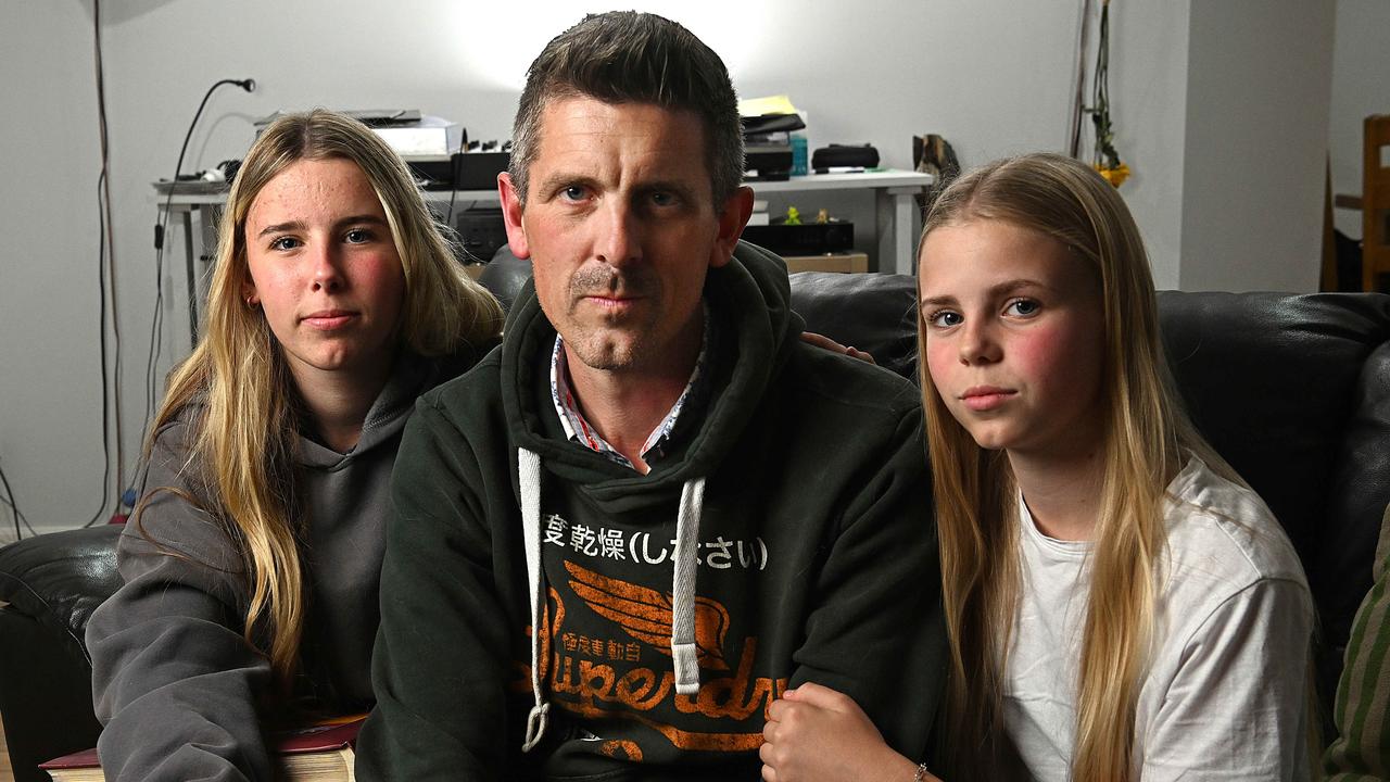 Lee Lovell and his daughters Scarlett (oldest) and Kassie at their home in North Lakes Brisbane. Lyndon Mechielsen/Courier Mail