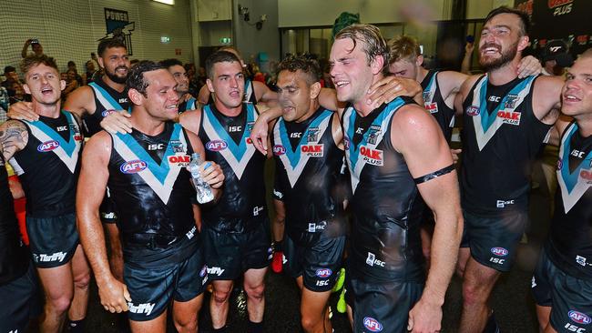 Steven Motlop, Tom Rockliff, Dom Barry and Jack Watts sing the Power song for the first time. Picture: Getty Images